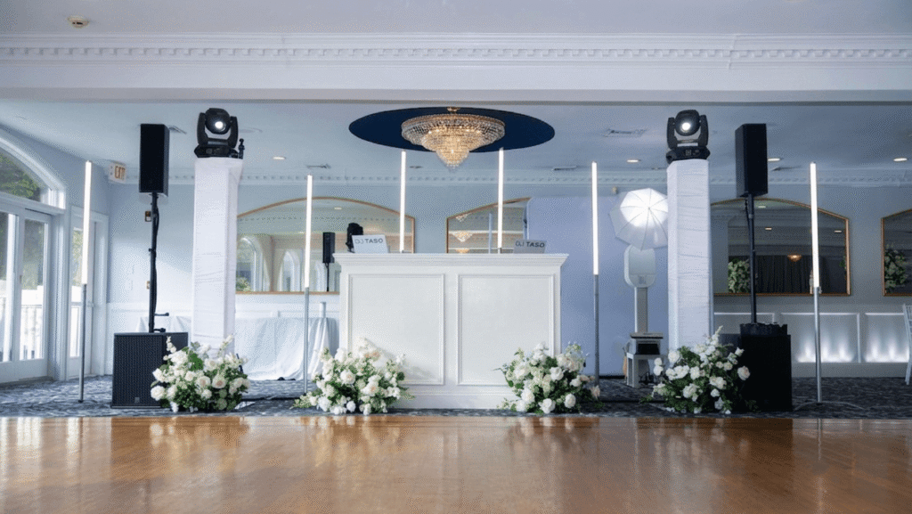High-energy Candlewood Inn wedding reception featuring a packed dance floor and custom DJ lighting setup